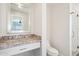 Bathroom vanity features granite countertop and decorative mirror at 4920 E Osborn Rd, Phoenix, AZ 85018