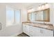 Bright bathroom features dual sinks, granite countertop, and decorative mirror at 4920 E Osborn Rd, Phoenix, AZ 85018