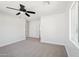 Spacious bedroom includes a ceiling fan, neutral carpet, and closet access at 4920 E Osborn Rd, Phoenix, AZ 85018
