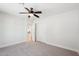 Bedroom features a ceiling fan, carpet, and closet at 4920 E Osborn Rd, Phoenix, AZ 85018