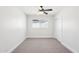 Cozy bedroom with neutral carpet, ceiling fan, and a closet at 4920 E Osborn Rd, Phoenix, AZ 85018