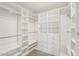 Expansive walk-in closet with custom shelving and drawers for optimal storage and organization at 4920 E Osborn Rd, Phoenix, AZ 85018