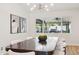 Modern dining room with contemporary light fixture, large windows, and stylish decor at 4920 E Osborn Rd, Phoenix, AZ 85018