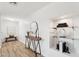 Inviting entryway with wood floors, console table with mirror, and decorative art niche at 4920 E Osborn Rd, Phoenix, AZ 85018