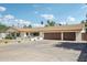 Beautiful single-story home with a spacious driveway, a three-car garage, and a lovely front porch at 4920 E Osborn Rd, Phoenix, AZ 85018