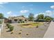Attractive single-story home featuring a landscaped front yard with gravel and small bushes at 4920 E Osborn Rd, Phoenix, AZ 85018