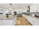Open kitchen featuring stainless steel appliances, granite countertops, tile backsplash, and hardwood floors at 4920 E Osborn Rd, Phoenix, AZ 85018