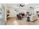 Bright living room with skylights, ceiling fans, modern furniture and decor, and wood-look floors at 4920 E Osborn Rd, Phoenix, AZ 85018