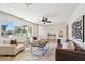 Cozy and bright living room showcasing stylish furniture, decor, and a large window with outdoor views at 4920 E Osborn Rd, Phoenix, AZ 85018