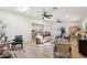 Open concept living room with skylights, ceiling fans, wood-look floors, modern furnishings and decor at 4920 E Osborn Rd, Phoenix, AZ 85018