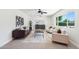 Bright living room with modern decor featuring a large window, stylish furniture, and plush carpeting at 4920 E Osborn Rd, Phoenix, AZ 85018