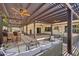Relaxing covered patio with stylish seating, ceiling fans, and a built-in bar area at 4920 E Osborn Rd, Phoenix, AZ 85018