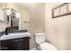 Modern bathroom with a sleek vanity, stylish sink, and contemporary toilet at 5612 S 21St Pl, Phoenix, AZ 85040