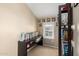 Small study area in bedroom with carpet, window and lots of natural light at 5612 S 21St Pl, Phoenix, AZ 85040