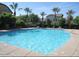Inviting community pool provides a refreshing escape with ample seating and views of the surrounding neighborhood at 5612 S 21St Pl, Phoenix, AZ 85040