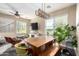 Bright dining space with a wooden table, bench seating, and lots of natural light at 5612 S 21St Pl, Phoenix, AZ 85040