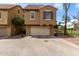 Charming two-story townhouse featuring a private garage and well-maintained landscaping at 5612 S 21St Pl, Phoenix, AZ 85040
