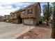 Townhouse exterior featuring a neutral color scheme and attached garages and desert landscaping at 5612 S 21St Pl, Phoenix, AZ 85040