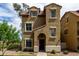 Charming two-story home with a tiled roof and lovely landscaped front yard at 5612 S 21St Pl, Phoenix, AZ 85040