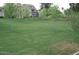 Expansive green lawn area with young trees, creating a serene and park-like environment for residents to enjoy at 5612 S 21St Pl, Phoenix, AZ 85040