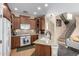 Charming kitchen with wooden cabinets, granite countertops, and stainless steel appliances at 5612 S 21St Pl, Phoenix, AZ 85040