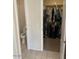 Bathroom features toilet, walk in closet with clothes hanging and shelves at 60 S Willow Creek St, Chandler, AZ 85225