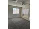 Carpeted bedroom featuring a window seat, window, and ceiling fan at 60 S Willow Creek St, Chandler, AZ 85225