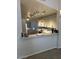 Well-lit kitchen featuring track lighting and a breakfast bar at 60 S Willow Creek St, Chandler, AZ 85225