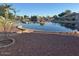 Backyard view overlooking calm lake and surrounding community at 60 S Willow Creek St, Chandler, AZ 85225
