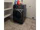 Laundry room featuring a black washer and dryer, and shelves at 60 S Willow Creek St, Chandler, AZ 85225