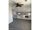 Loft area featuring railing with a ceiling fan and sky light, and window at 60 S Willow Creek St, Chandler, AZ 85225