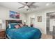 Relaxing bedroom featuring a plush bed, nightstands, and decorative artwork for a serene atmosphere at 6305 W Pleasant Oak Ct, Florence, AZ 85132