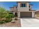 Charming two-story home featuring a neutral color palette and a two-car garage with a concrete driveway at 6305 W Pleasant Oak Ct, Florence, AZ 85132