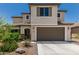 Charming two-story home featuring a neutral color palette and a two-car garage with a concrete driveway at 6305 W Pleasant Oak Ct, Florence, AZ 85132