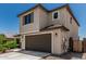 Charming two-story home featuring a neutral color palette and a two-car garage with a concrete driveway at 6305 W Pleasant Oak Ct, Florence, AZ 85132