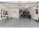 Large two car garage with epoxy floors and ample storage and organization with multiple shelving units at 6305 W Pleasant Oak Ct, Florence, AZ 85132