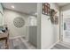 Nicely decorated hallway featuring hardwood floors and decorative artwork leading to the bathroom at 6305 W Pleasant Oak Ct, Florence, AZ 85132