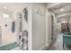 Hallway with hooks and decor, and access to the bathroom and bedroom at 6305 W Pleasant Oak Ct, Florence, AZ 85132