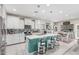 Bright kitchen with an island, white cabinets, pendant lighting, and a mosaic tile backsplash at 6305 W Pleasant Oak Ct, Florence, AZ 85132