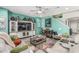 Inviting living room boasts a stylish entertainment center and colorful decor with a ceiling fan at 6305 W Pleasant Oak Ct, Florence, AZ 85132