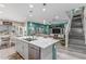 Bright, open floor plan with a spacious kitchen island flowing into the dining and living areas at 6305 W Pleasant Oak Ct, Florence, AZ 85132
