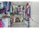 Walk-in closet offering ample storage, organization shelving, and hanging racks for clothing and accessories at 6305 W Pleasant Oak Ct, Florence, AZ 85132