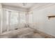 Spacious bedroom with natural light, a ceiling fan, and dated finishes at 6391 S Oakmont Dr, Chandler, AZ 85249
