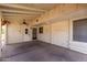 View of a covered carport with a ceiling fan and doorway leading into the home at 6391 S Oakmont Dr, Chandler, AZ 85249