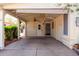Attached carport featuring a ceiling fan, front door access, and protective covering for vehicles at 6391 S Oakmont Dr, Chandler, AZ 85249
