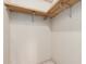 Image shows the inside of a closet with copper pipes, light colored walls, and some shelving at 6391 S Oakmont Dr, Chandler, AZ 85249