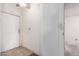 Bright entryway with a white front door, neutral tile floor, and a ceiling fan at 6391 S Oakmont Dr, Chandler, AZ 85249