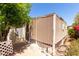 Home's exterior showcases its screened-in patio and mature landscaping at 6391 S Oakmont Dr, Chandler, AZ 85249