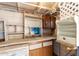 Garage area includes wood shelving and cabinets and countertop at 6391 S Oakmont Dr, Chandler, AZ 85249