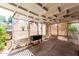 Screened-in patio, complete with lattice work, ceiling fan, and room for container gardening at 6391 S Oakmont Dr, Chandler, AZ 85249